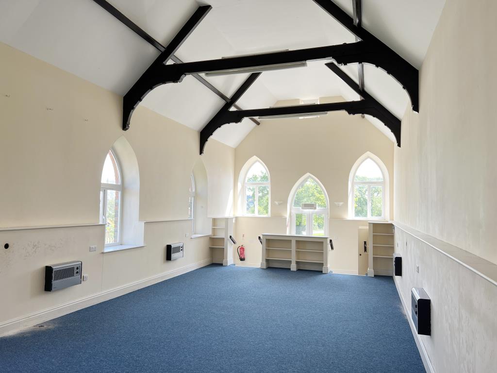 Lot: 51 - FORMER CHURCH WITH PLANNING PERMISSION FOR CONVERSION AND VACANT HALL - Inside Church with smooth plastered an painted walls with exposed timber beams